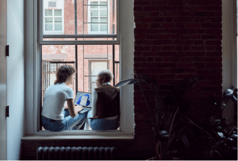 People in apartment on computer